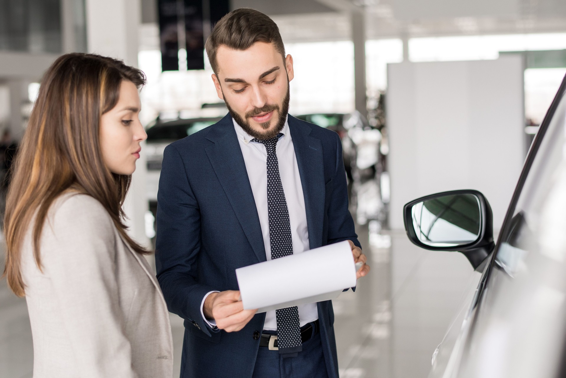 Handsome Car Salesman Talking to Client